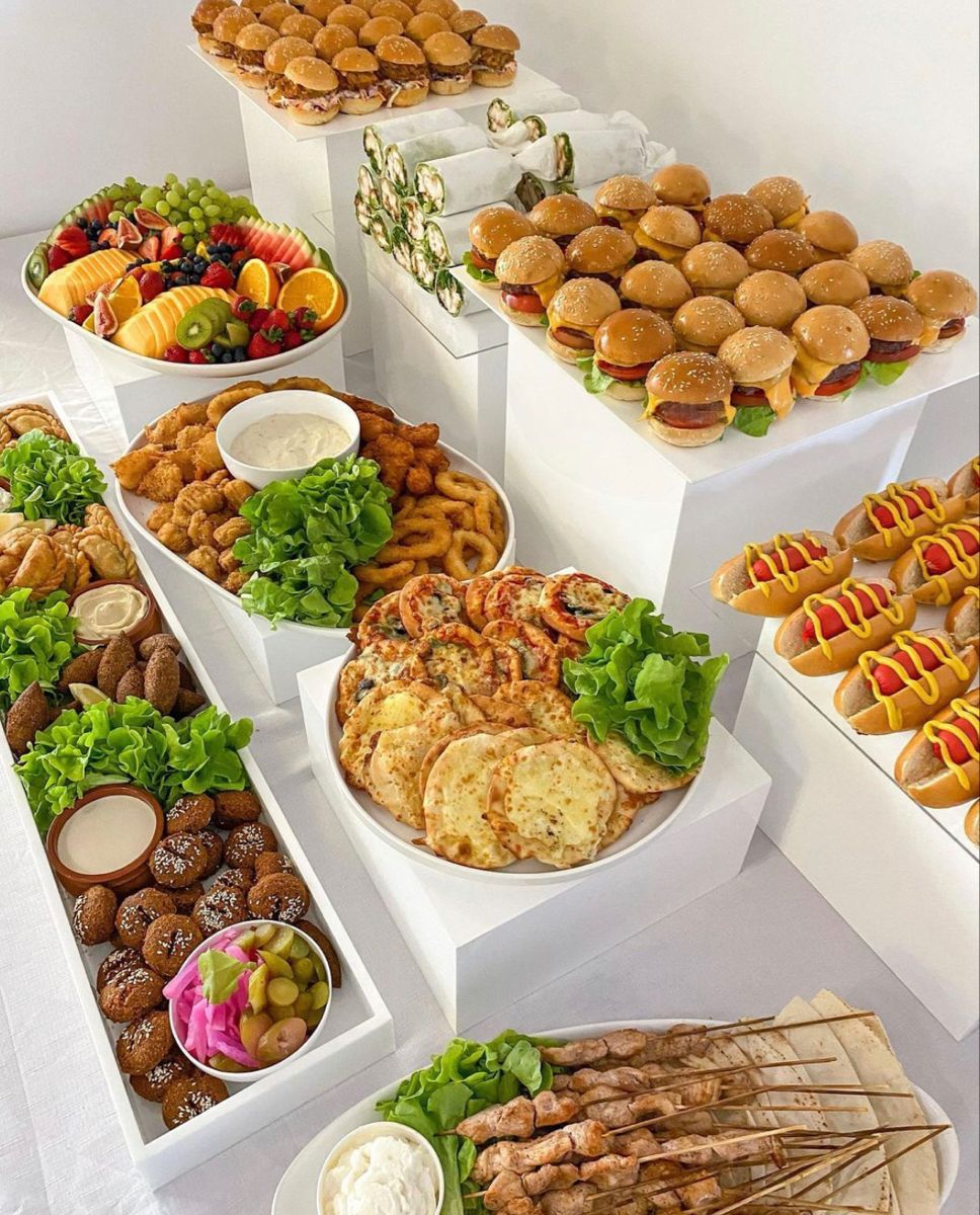 Modern Lebanese catering with tiered white serving platforms